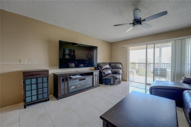 170 SE 5th Ave Unit 505, Dania Beach, FL 33004 - living area featuring a ceiling fan, a textured ceiling, and light tile patterned flooring