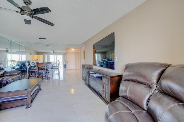 170 SE 5th Ave Unit 505, Dania Beach, FL 33004 - living room with ceiling fan and light tile patterned flooring