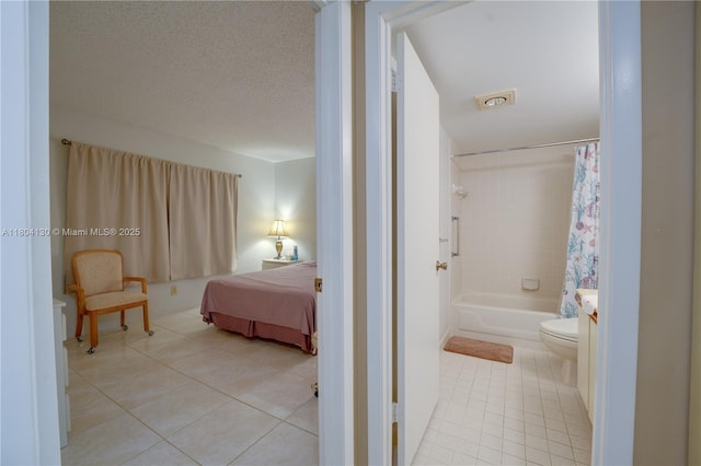 170 SE 5th Ave Unit 505, Dania Beach, FL 33004 - full bath with tile patterned floors, toilet, and shower / tub combo with curtain