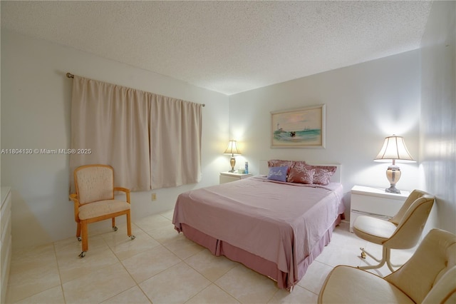 170 SE 5th Ave Unit 505, Dania Beach, FL 33004 - bedroom with a textured ceiling and light tile patterned floors