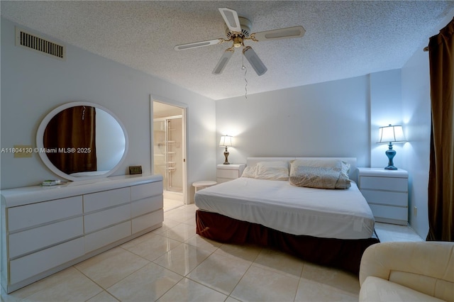 170 SE 5th Ave Unit 505, Dania Beach, FL 33004 - bedroom with a textured ceiling, light tile patterned floors, ensuite bathroom, and a ceiling fan