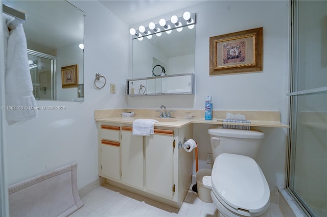 170 SE 5th Ave Unit 505, Dania Beach, FL 33004 - bathroom featuring a stall shower, toilet, vanity, and tile patterned flooring