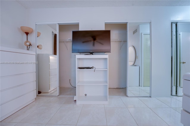 170 SE 5th Ave Unit 505, Dania Beach, FL 33004 - unfurnished bedroom with two closets and tile patterned flooring