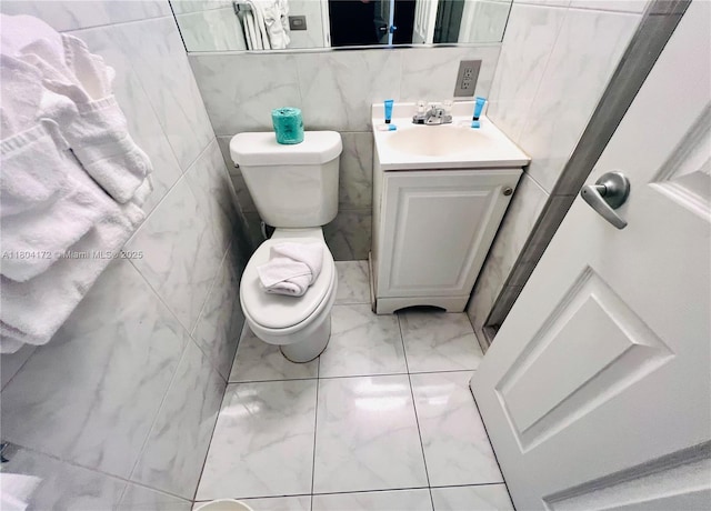 6345 Collins Ave Unit 818, Miami Beach, FL 33141 - bathroom with marble finish floors, toilet, and vanity