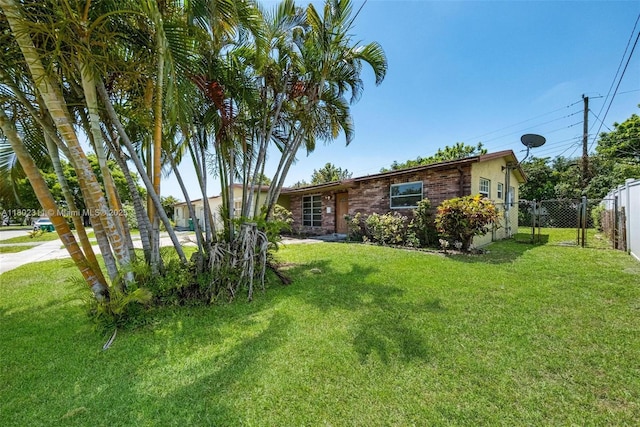 4240 NW 22nd St, Lauderhill, FL 33313 - view of front facade with a gate