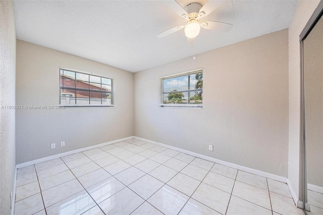 4240 NW 22nd St, Lauderhill, FL 33313 - spare room with plenty of natural light, light tile patterned floors, baseboards, and a ceiling fan