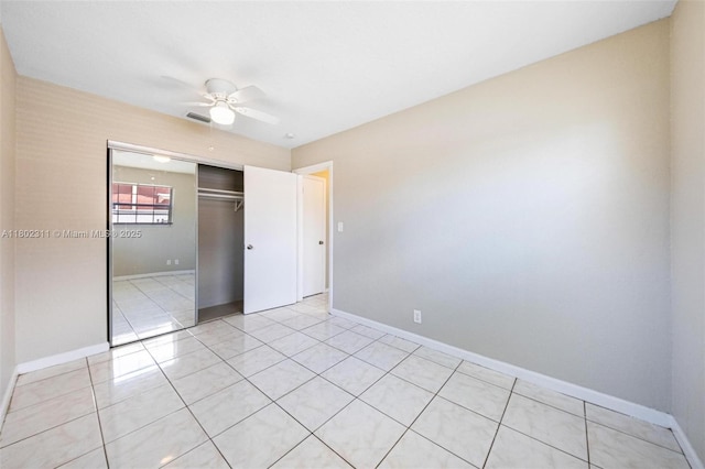 4240 NW 22nd St, Lauderhill, FL 33313 - unfurnished bedroom with a closet, baseboards, light tile patterned floors, and ceiling fan