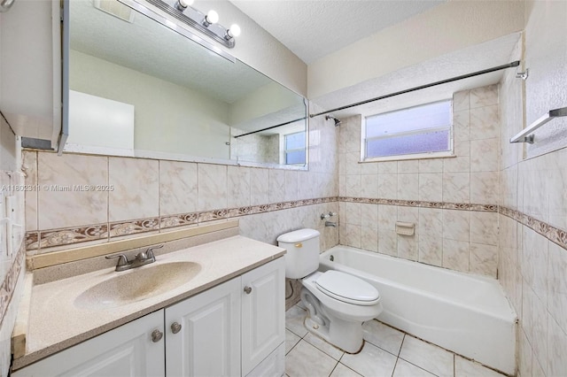4240 NW 22nd St, Lauderhill, FL 33313 - bathroom featuring tile walls,  shower combination, toilet, vanity, and tile patterned floors