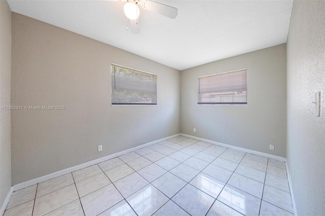 4240 NW 22nd St, Lauderhill, FL 33313 - empty room featuring ceiling fan, light tile patterned floors, and baseboards