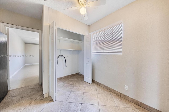 4240 NW 22nd St, Lauderhill, FL 33313 - unfurnished bedroom featuring a closet, light tile patterned floors, a ceiling fan, and baseboards