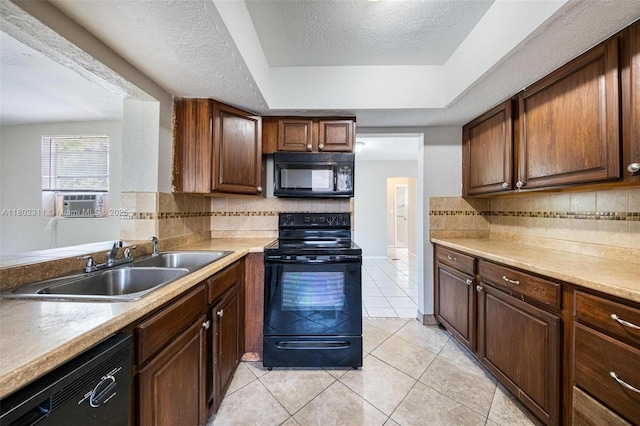 4240 NW 22nd St, Lauderhill, FL 33313 - kitchen with black appliances, a sink, a tray ceiling, decorative backsplash, and a textured ceiling