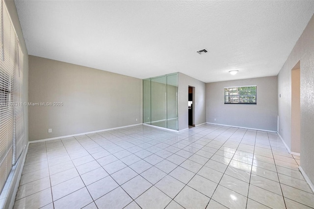 4240 NW 22nd St, Lauderhill, FL 33313 - empty room with light tile patterned floors and baseboards