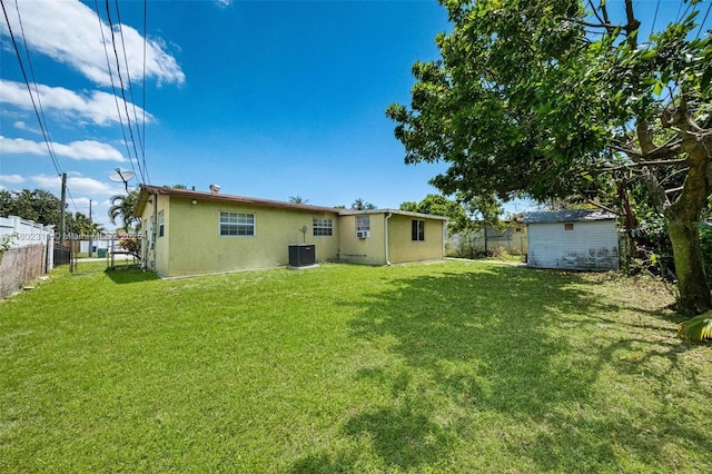 4240 NW 22nd St, Lauderhill, FL 33313 - rear view of house with central air condition unit and stucco siding