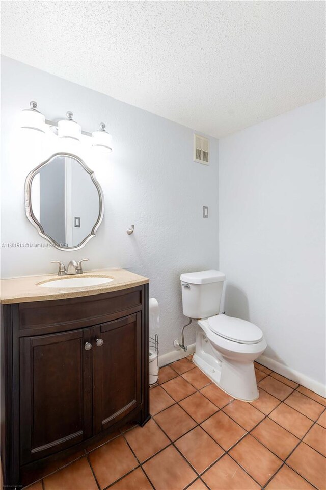8693 SW 137th Ave Unit 8693, Miami, FL 33183 - half bathroom featuring a textured ceiling, vanity, and tile patterned flooring
