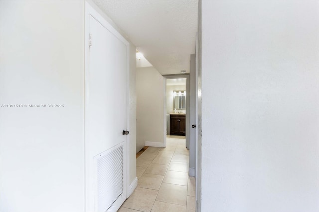 8693 SW 137th Ave Unit 8693, Miami, FL 33183 - hallway with light tile patterned floors and baseboards