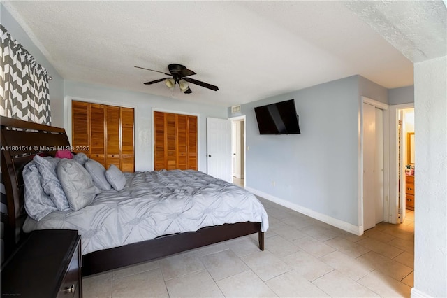8693 SW 137th Ave Unit 8693, Miami, FL 33183 - bedroom with multiple closets, ceiling fan, and a textured ceiling