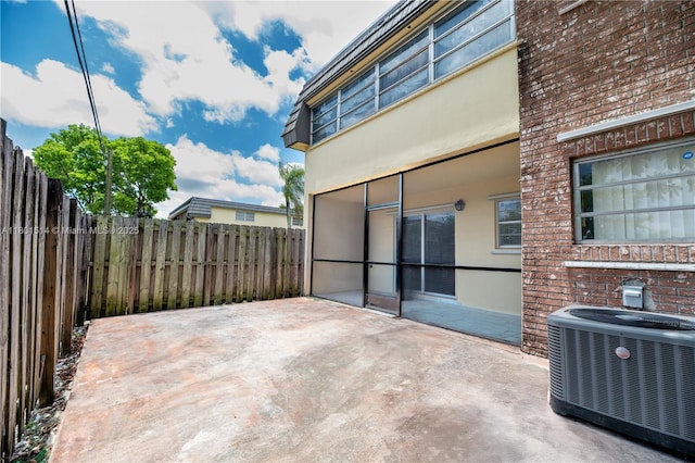 8693 SW 137th Ave Unit 8693, Miami, FL 33183 - view of patio / terrace featuring cooling unit and a fenced backyard
