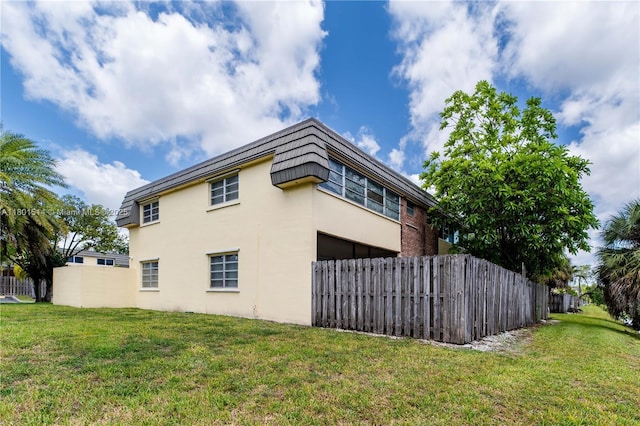 8693 SW 137th Ave Unit 8693, Miami, FL 33183 - view of home's exterior with stucco siding and mansard roof