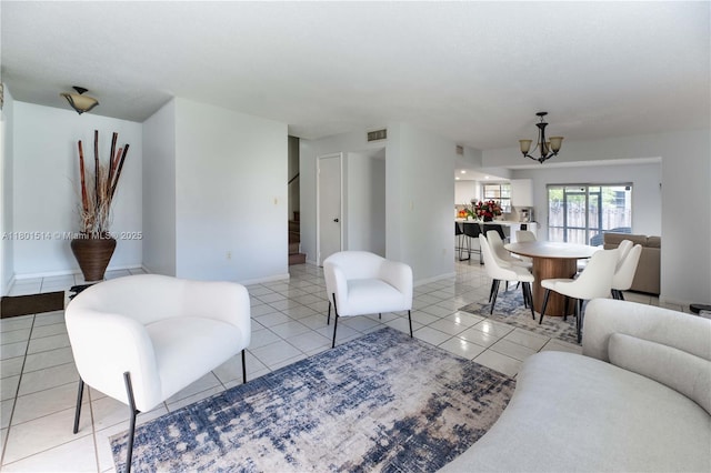 8693 SW 137th Ave Unit 8693, Miami, FL 33183 - living room with a chandelier, stairs, baseboards, and light tile patterned floors