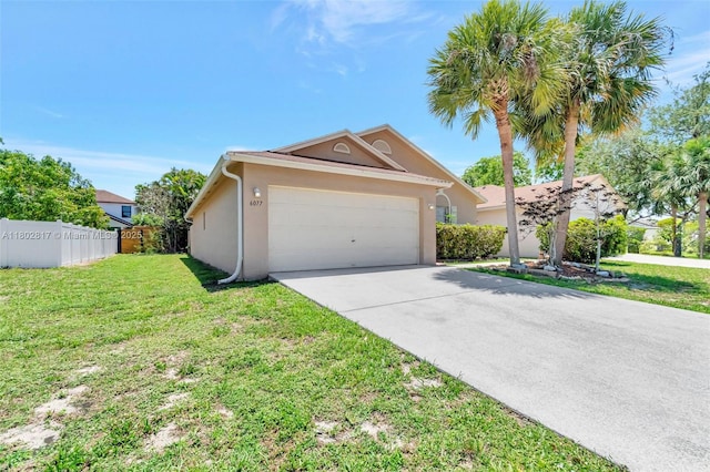 6077 Azalea Cir, West Palm Beach, FL 33415 - view of front of home with stucco siding, an attached garage, and concrete driveway