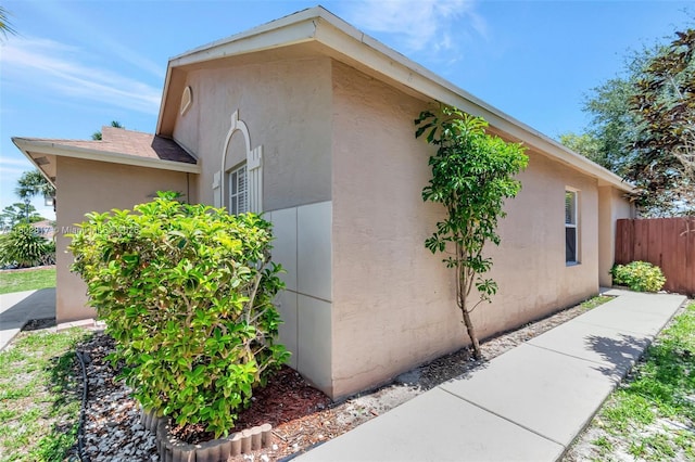6077 Azalea Cir, West Palm Beach, FL 33415 - view of side of property featuring stucco siding