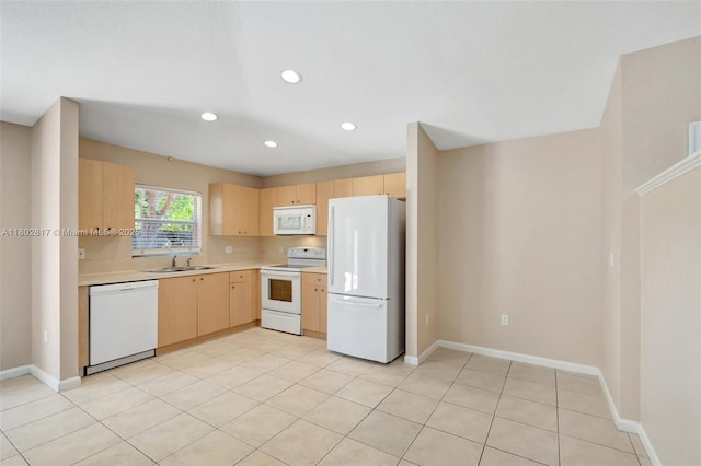 6077 Azalea Cir, West Palm Beach, FL 33415 - kitchen featuring white appliances, light brown cabinetry, a sink, light countertops, and recessed lighting
