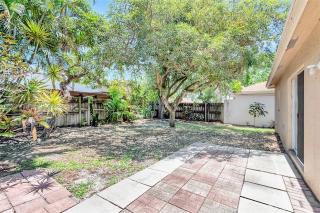 6077 Azalea Cir, West Palm Beach, FL 33415 - fenced backyard featuring a patio