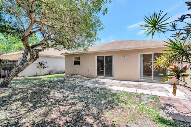 6077 Azalea Cir, West Palm Beach, FL 33415 - rear view of property with stucco siding and a patio