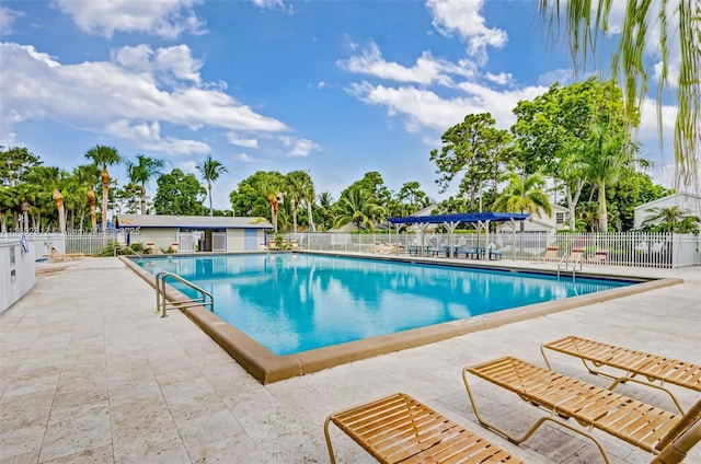 6077 Azalea Cir, West Palm Beach, FL 33415 - community pool featuring a patio