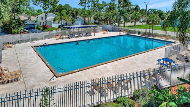 6077 Azalea Cir, West Palm Beach, FL 33415 - community pool featuring a patio area