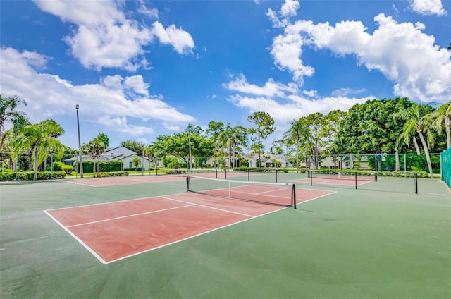 6077 Azalea Cir, West Palm Beach, FL 33415 - view of tennis court with community basketball court