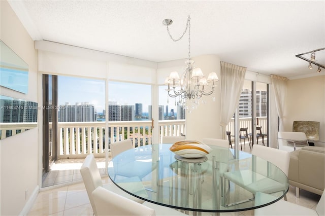 1000 W Island Blvd Unit 2707, Aventura, FL 33160 - dining space with a skyline view, a chandelier, light tile patterned flooring, and a textured ceiling