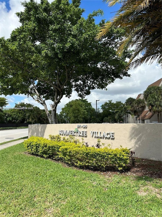 601 Ives Dairy Rd Unit 401-8, Miami, FL 33179 - community / neighborhood sign featuring a lawn