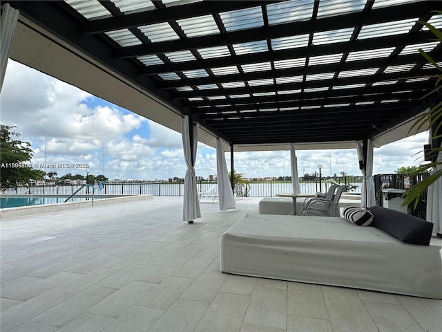 601 Ives Dairy Rd Unit 401-8, Miami, FL 33179 - view of patio featuring fence, a water view, and a pergola