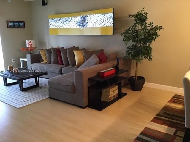16141 Blatt Blvd Unit 311, Weston, FL 33326 - living area with wood finished floors and baseboards