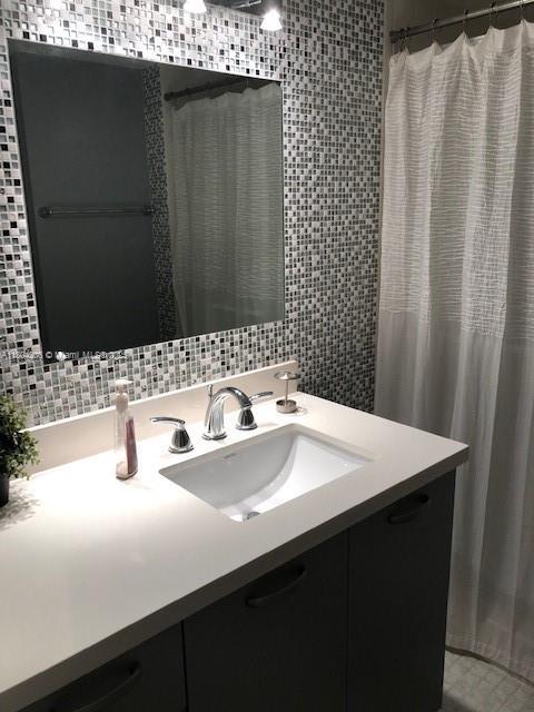 16141 Blatt Blvd Unit 311, Weston, FL 33326 - full bath featuring vanity and tile walls