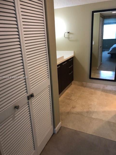 16141 Blatt Blvd Unit 311, Weston, FL 33326 - bathroom with baseboards and vanity
