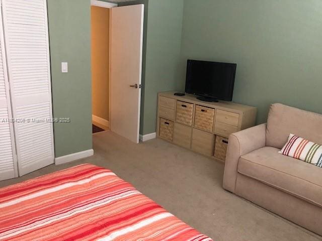 16141 Blatt Blvd Unit 311, Weston, FL 33326 - bedroom with light carpet and baseboards