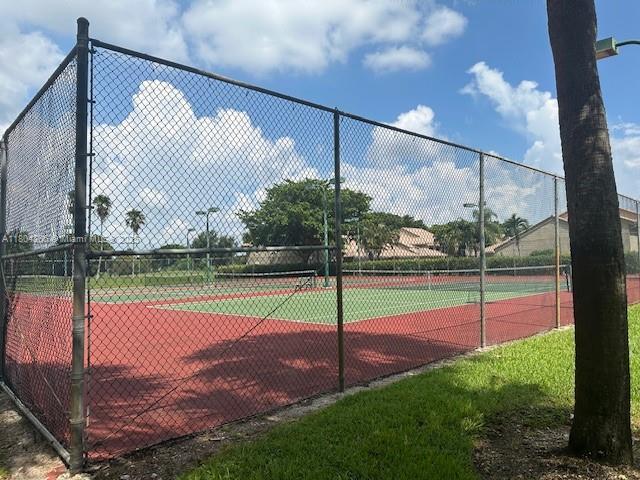16141 Blatt Blvd Unit 311, Weston, FL 33326 - view of tennis court with fence