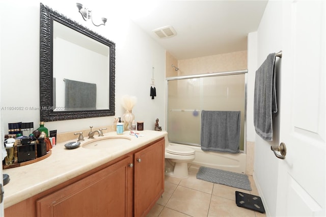 5271 SW 8th St Unit 311, Miami, FL 33134 - bathroom with toilet, tile patterned flooring, vanity, and combined bath / shower with glass door