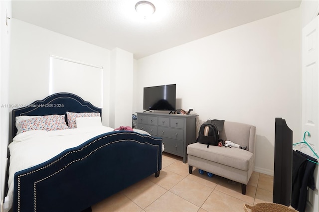 5271 SW 8th St Unit 311, Miami, FL 33134 - bedroom featuring light tile patterned floors and baseboards