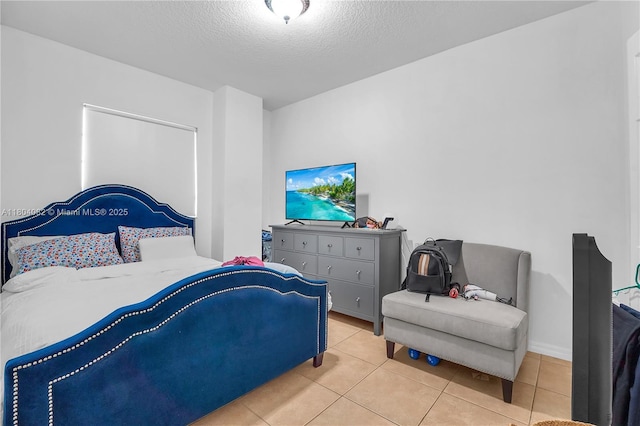 5271 SW 8th St Unit 311, Miami, FL 33134 - bedroom with light tile patterned floors and a textured ceiling