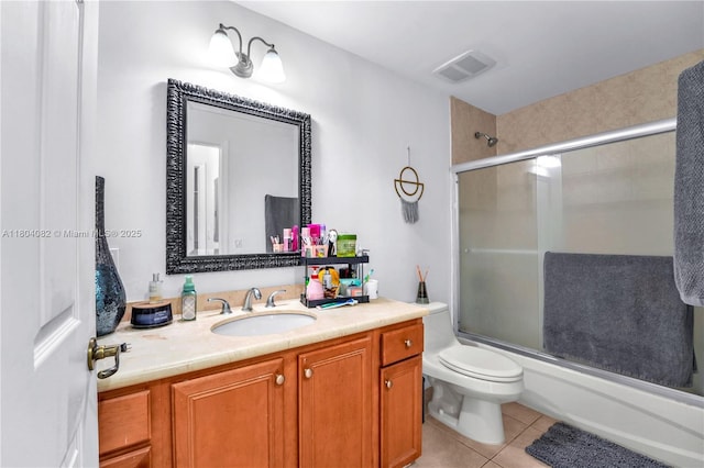 5271 SW 8th St Unit 311, Miami, FL 33134 - full bathroom with vanity, combined bath / shower with glass door, tile patterned flooring, and toilet