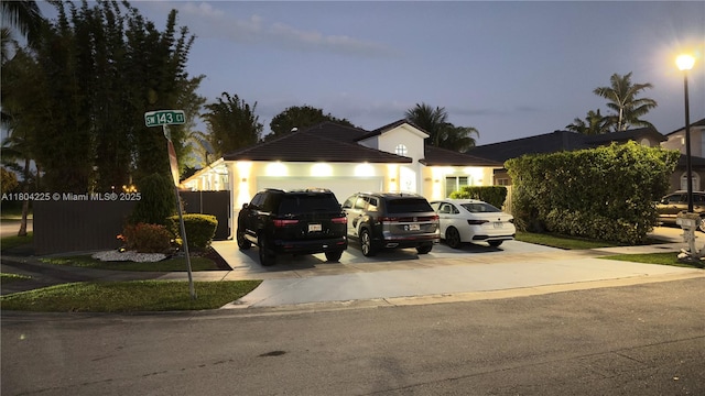 17201 SW 143rd Ct, Miami, FL 33177 - view of front of home with an attached garage and driveway