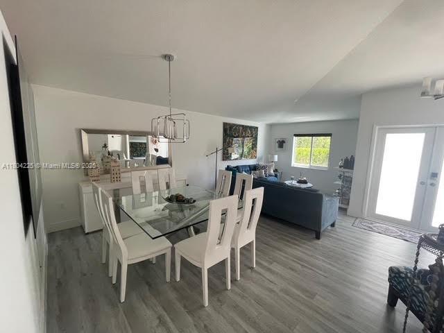 17201 SW 143rd Ct, Miami, FL 33177 - dining room with a chandelier, wood finished floors, and french doors