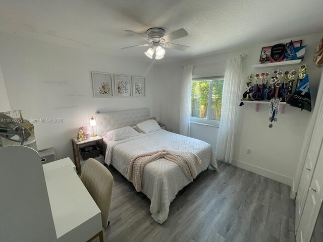 17201 SW 143rd Ct, Miami, FL 33177 - bedroom with wood finished floors, baseboards, and a ceiling fan