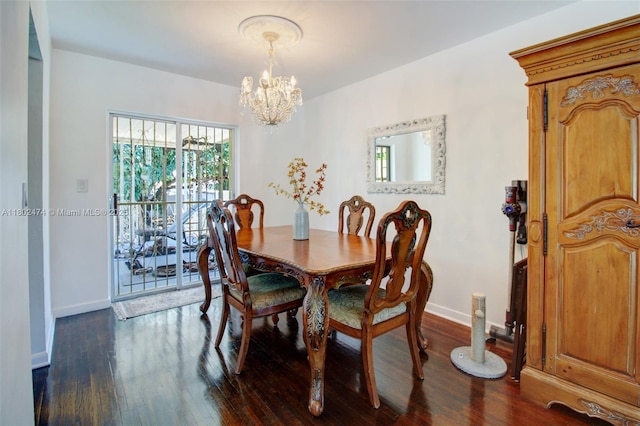 928 W 31st St, Hialeah, FL 33012 - dining room featuring a chandelier, plenty of natural light, dark wood-type flooring, and baseboards
