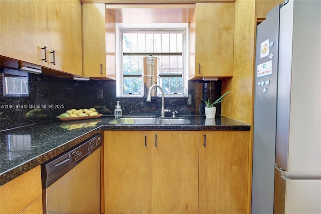 928 W 31st St, Hialeah, FL 33012 - kitchen with appliances with stainless steel finishes, a sink, decorative backsplash, and dark stone counters
