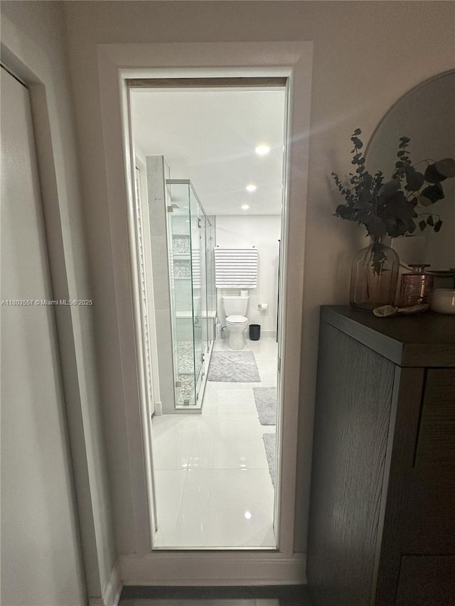 corridor featuring baseboards