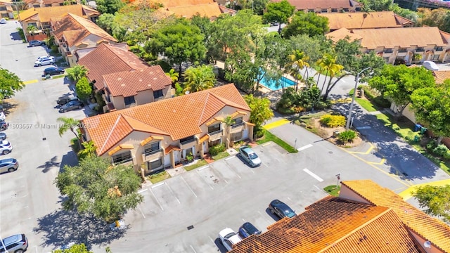 aerial view of residential area with a pool